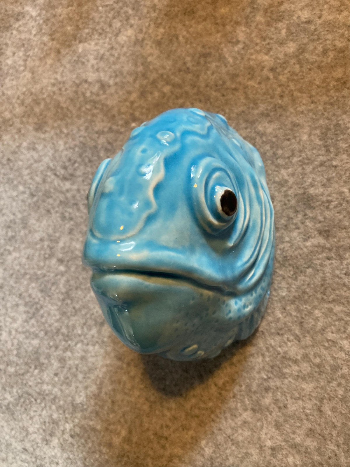 Handmade ceramic Fish wall sculpture, showing its aquamarine glaze.