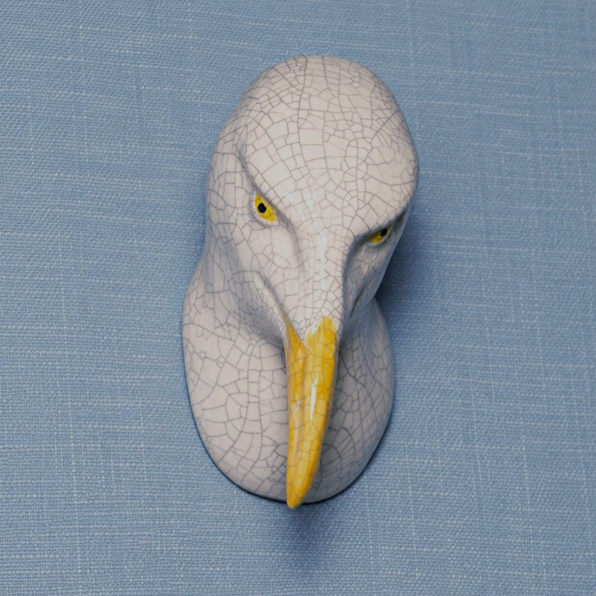 Close-up of handmade ceramic Right-Leaning Seagull showing its sculpted details.