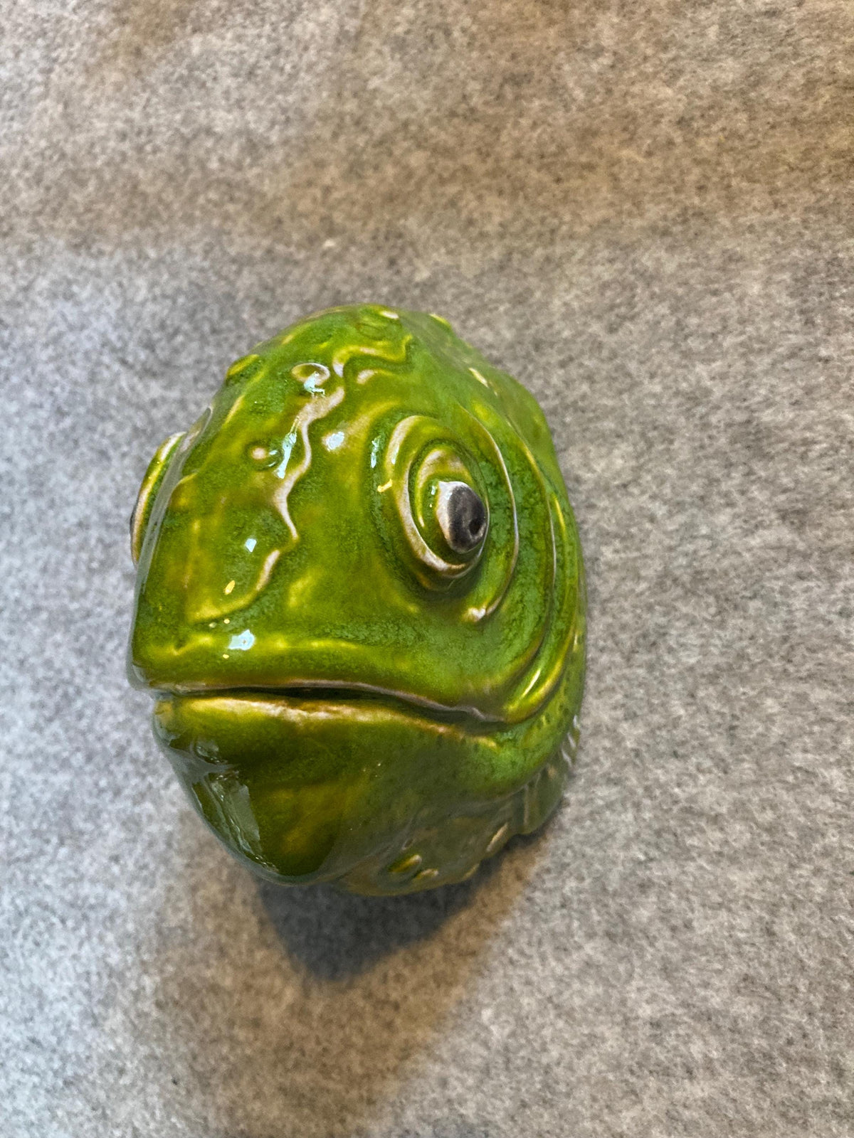 Handmade ceramic Fish wall sculpture, showing its grass snake green glaze.